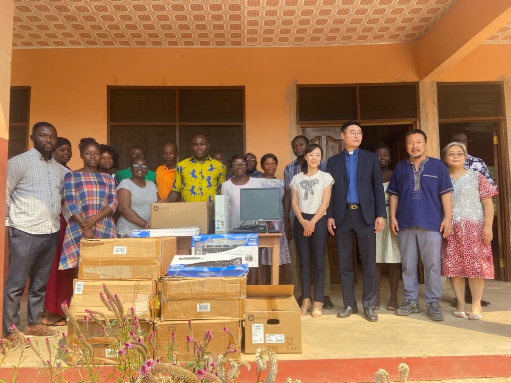 Rev. Cho, donates two sets of computers and 50 new keyboards to Luom Basic school